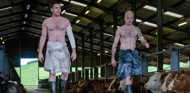 Mark Renton (Ewan McGregor) and Simon (Jonny Lee Miller) striding out of cow barn in TriStar PicturesÕ T2 TRAINSPOTTING